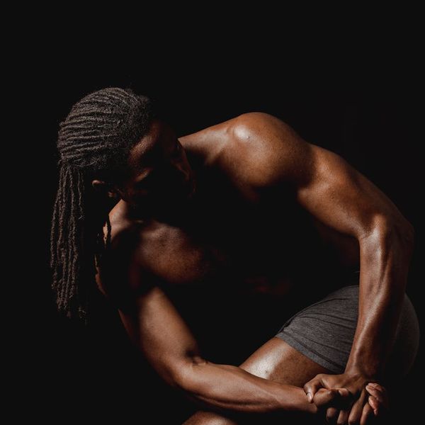 Silhouette of a man in a powerful stance, representing focus and inner strength.